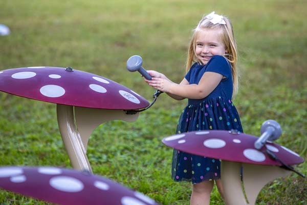 Young girl playing the Mushrooms